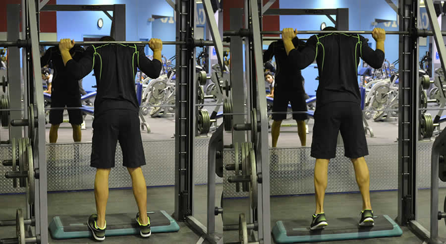 Calve Raises on Smith Machine Performed by Male Personal Trainer