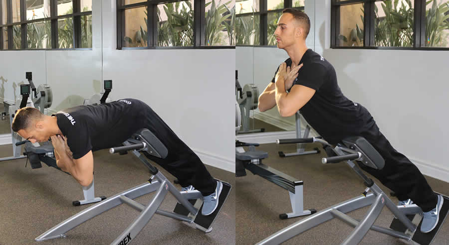 Hyperextensions Performed by Male Personal Trainer