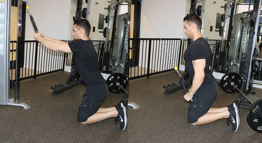 cable pulldown from knees performed by male personal trainer