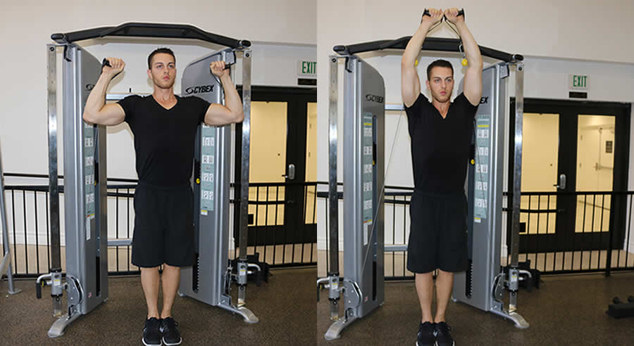 cable shoulder press performed by male personal trainer