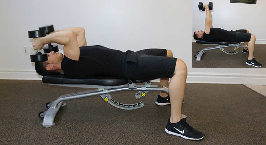 flat dumbbell extension performed by male personal trainer