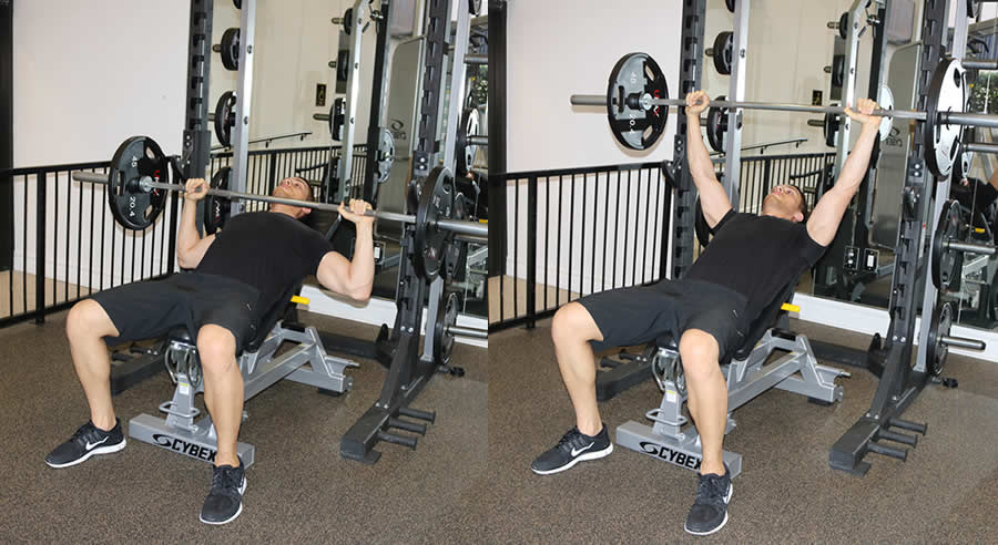 incline barbell press performed by male personal trainer